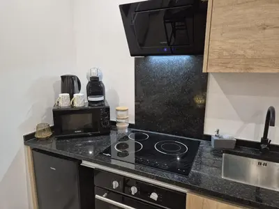 Cuisine ou kitchenette dans l'établissement Appartement complet a 2 pas de la Gare-Centre