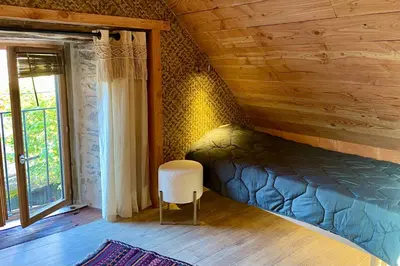 Un ou plusieurs lits dans un hébergement de l'établissement Warm and cozy house