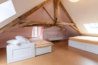 Un ou plusieurs lits dans un hébergement de l'établissement Charming accommodation for families, Ségur-le-Château