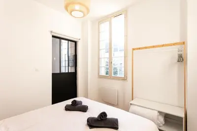 Un ou plusieurs lits dans un hébergement de l'établissement Appartement Brive Centre Historique