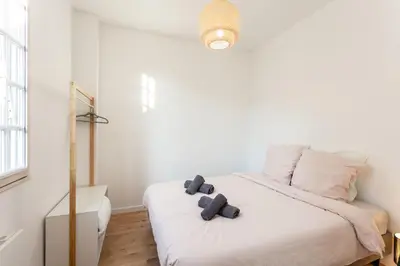 Un ou plusieurs lits dans un hébergement de l'établissement Appartement Brive Centre Historique