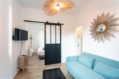 Télévision ou salle de divertissement dans l'établissement Appartement Brive Centre Historique