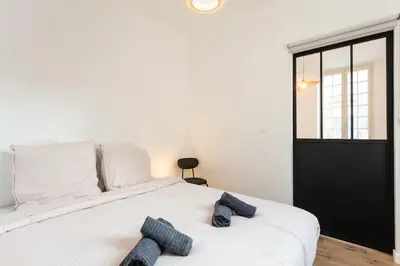 Un ou plusieurs lits dans un hébergement de l'établissement Appartement Brive Centre Historique
