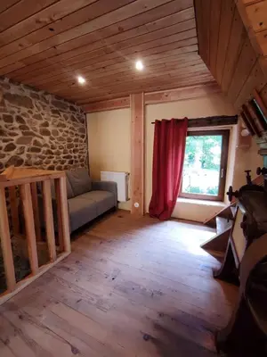 Coin salon dans l'établissement Le Moulin de la Hire