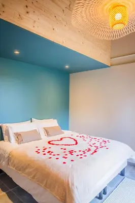 Un ou plusieurs lits dans un hébergement de l'établissement Spa et vue imprenable En haut du paradis