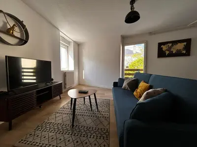 Coin salon dans l'établissement Le Grand Nid en Haut, duplex