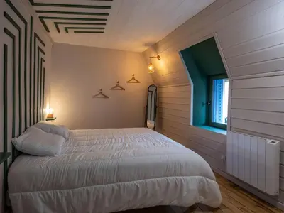 Un ou plusieurs lits dans un hébergement de l'établissement Maison auvergnate cœur de village
