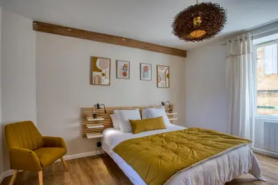 Un ou plusieurs lits dans un hébergement de l'établissement Maison T3 tout confort et spa Le Clos des Pierres