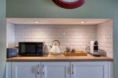 Cuisine ou kitchenette dans l'établissement Maison T3 tout confort et spa Le Clos des Pierres