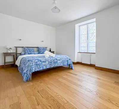 Un ou plusieurs lits dans un hébergement de l'établissement Maison de caractère au cœur du Périgord