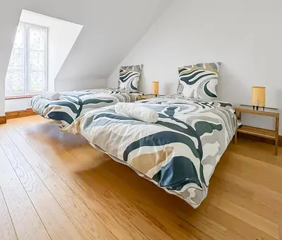 Un ou plusieurs lits dans un hébergement de l'établissement Maison de caractère au cœur du Périgord