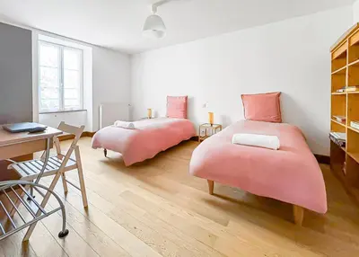 Un ou plusieurs lits dans un hébergement de l'établissement Maison de caractère au cœur du Périgord