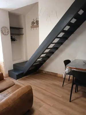 Coin salon dans l'établissement le nid des choups le petit duplex1