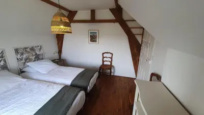 Un ou plusieurs lits dans un hébergement de l'établissement Maison Valentine