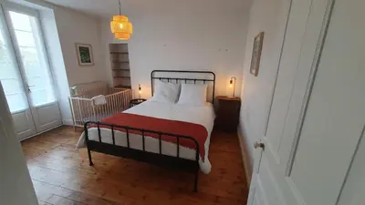 Un ou plusieurs lits dans un hébergement de l'établissement Maison Valentine
