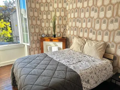 Un ou plusieurs lits dans un hébergement de l'établissement Studio Cozy & Vintage dans le centre ville
