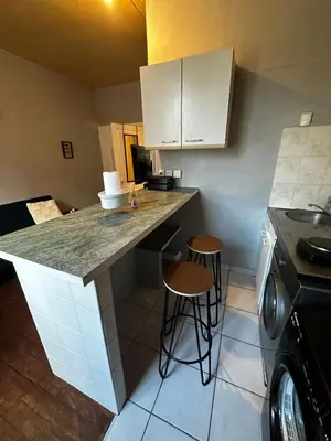 Cuisine ou kitchenette dans l'établissement Studio Cozy & Vintage dans le centre ville