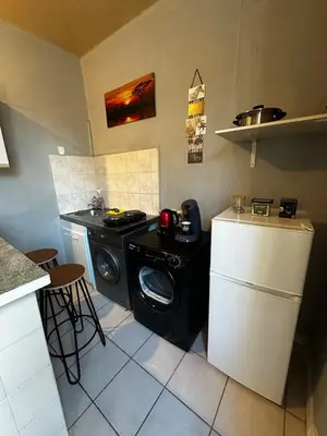 Cuisine ou kitchenette dans l'établissement Studio Cozy & Vintage dans le centre ville