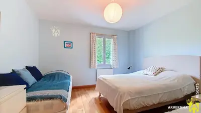 Un ou plusieurs lits dans un hébergement de l'établissement Chalet Flore