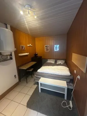 Un ou plusieurs lits dans un hébergement de l'établissement Petit studio centre mont dore
