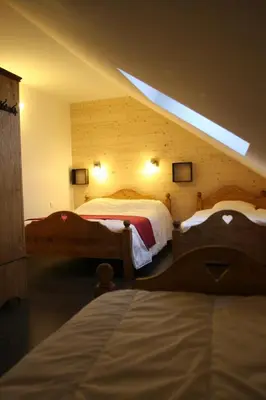 Un ou plusieurs lits dans un hébergement de l'établissement Chalet camp de base pour tribu sportif wifi 5 ch