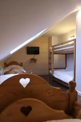 Un ou plusieurs lits dans un hébergement de l'établissement Chalet camp de base pour tribu sportif wifi 5 ch