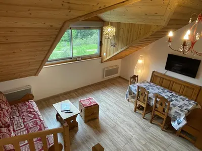 Télévision ou salle de divertissement dans l'établissement ALTURA T2 Duplex wifi au pied des montagnes