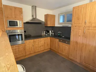 Cuisine ou kitchenette dans l'établissement Rocher du Cerf skis aux pieds 3 ch 2 sdb