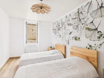 Un ou plusieurs lits dans un hébergement de l'établissement Jolie maison pour 4 à proximité du centre