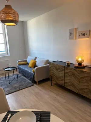 Coin salon dans l'établissement Le Pavillon - Hyper centre - charme rénové