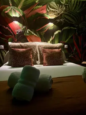 Un ou plusieurs lits dans un hébergement de l'établissement Casa Jungle - Le Studio Végétal - Confort & Design