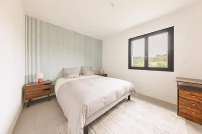 Un ou plusieurs lits dans un hébergement de l'établissement Maison de Maud - Piscine privée