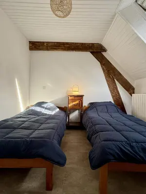 Un ou plusieurs lits dans un hébergement de l'établissement Maison Équilibre