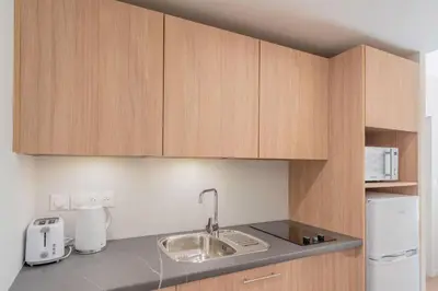 Cuisine ou kitchenette dans l'établissement Quality Aparthotel Limoges