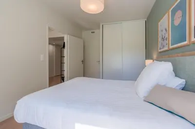 Un ou plusieurs lits dans un hébergement de l'établissement Quality Aparthotel Limoges