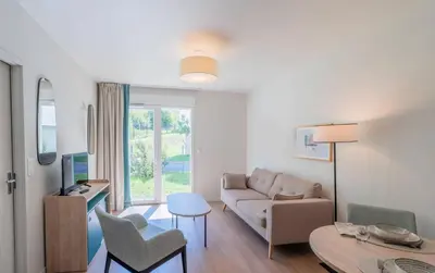 Télévision ou salle de divertissement dans l'établissement Quality Aparthotel Limoges