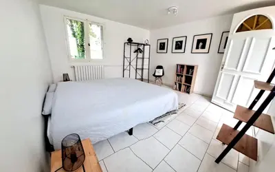 Un ou plusieurs lits dans un hébergement de l'établissement Appartement cosy avec jardin - Stationnement gratuit