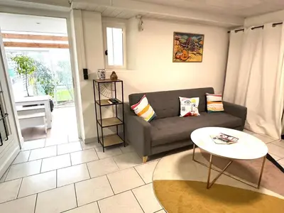 Coin salon dans l'établissement Appartement cosy avec jardin - Stationnement gratuit