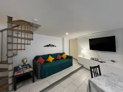 Télévision ou salle de divertissement dans l'établissement Spacieux Duplex à La Bourboule, 87m² pour 6 pers. - FR-1-608-296