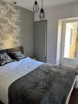 Un ou plusieurs lits dans un hébergement de l'établissement Bel Appartement T2