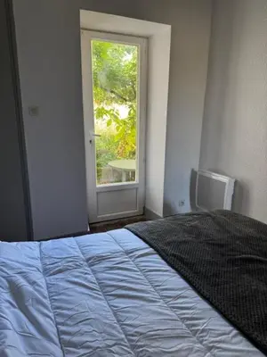 Un ou plusieurs lits dans un hébergement de l'établissement Bel Appartement T2