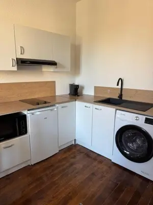 Cuisine ou kitchenette dans l'établissement Bel Appartement T2