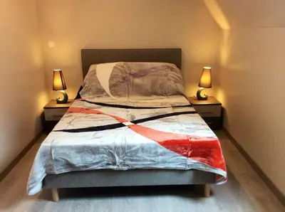 Un ou plusieurs lits dans un hébergement de l'établissement Gîte Les Nougats, location 8 personnes