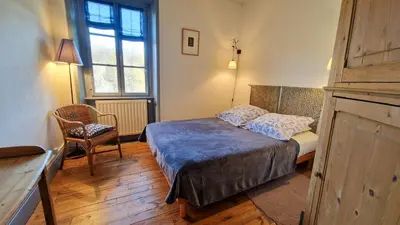 Un ou plusieurs lits dans un hébergement de l'établissement Chambres d'hôtes La Marche des Bois