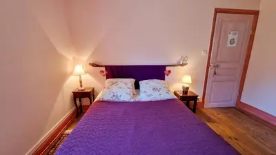 Un ou plusieurs lits dans un hébergement de l'établissement Chambres d'hôtes La Marche des Bois