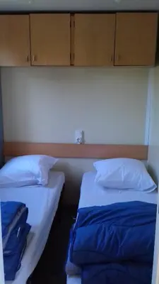 Un ou plusieurs lits dans un hébergement de l'établissement CAMPING de la BUGE