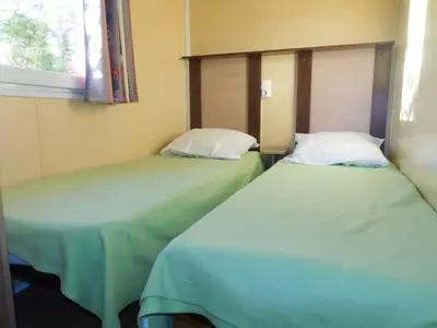 Un ou plusieurs lits dans un hébergement de l'établissement CAMPING de la BUGE