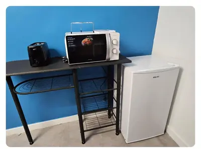 Cuisine ou kitchenette dans l'établissement Alphonse
