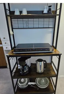 Cuisine ou kitchenette dans l'établissement Alphonse