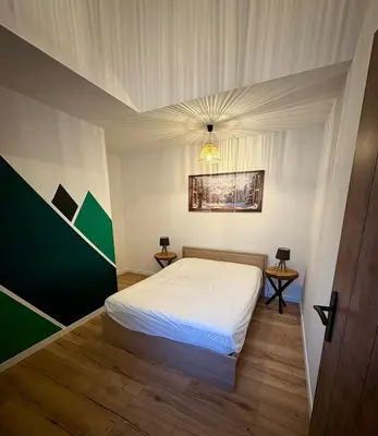 Un ou plusieurs lits dans un hébergement de l'établissement Gîte Les Aubracs - Puy de Dôme - Massif du Sancy